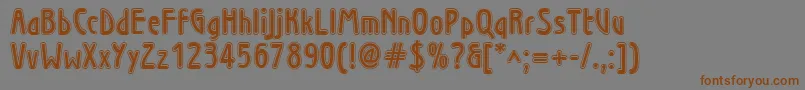 フォントWninl – 茶色の文字が灰色の背景にあります。