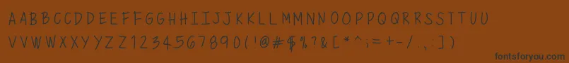 Mixminicaps Font – Black Fonts on Brown Background