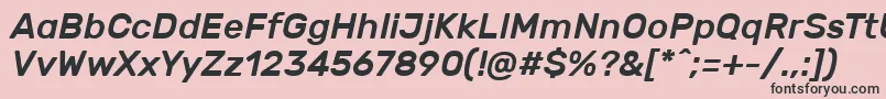 RubikMediumitalic-fontti – mustat fontit vaaleanpunaisella taustalla