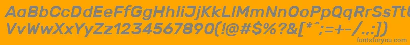 RubikMediumitalic-fontti – harmaat kirjasimet oranssilla taustalla