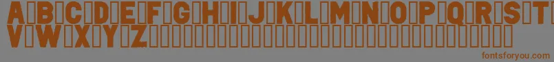 フォントPunkRockColorFill – 茶色の文字が灰色の背景にあります。
