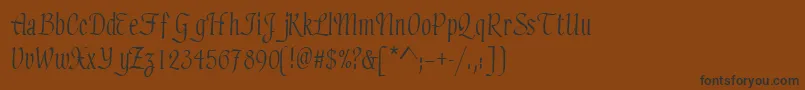 フォントElicitsskRegular – 黒い文字が茶色の背景にあります