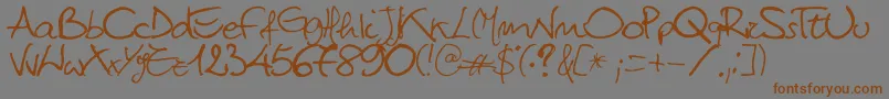 フォントTitti – 茶色の文字が灰色の背景にあります。