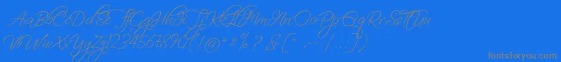 FascinatingChristmas-Schriftart – Graue Schriften auf blauem Hintergrund