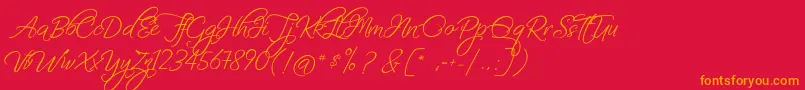 フォントFascinatingChristmas – 赤い背景にオレンジの文字