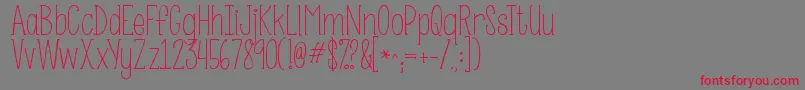 Kgsomebodythatiusedtoknow-Schriftart – Rote Schriften auf grauem Hintergrund