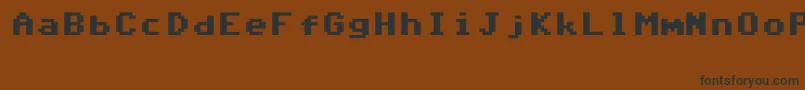 フォントCommodore64V6.3 – 黒い文字が茶色の背景にあります