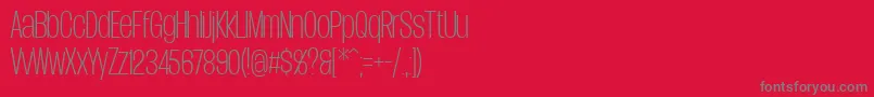 フォントDueraCondthinPersonal – 赤い背景に灰色の文字