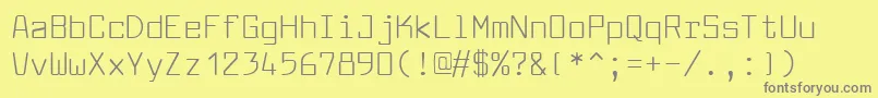 Larabiefont-fontti – harmaat kirjasimet keltaisella taustalla