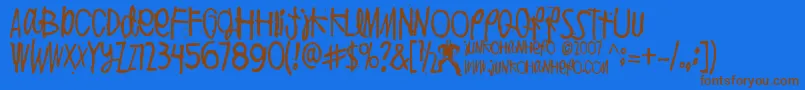 PuoliIhminen Font – Brown Fonts on Blue Background