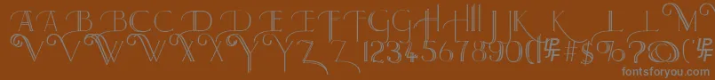 LarkinCapitals-Schriftart – Graue Schriften auf braunem Hintergrund