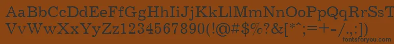 フォントJournalCyrillic – 黒い文字が茶色の背景にあります