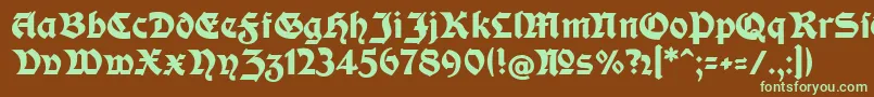 フォントModerneFetteSchwabacher – 緑色の文字が茶色の背景にあります。