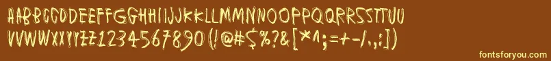 MuspiMerolKrad Font – Yellow Fonts on Brown Background