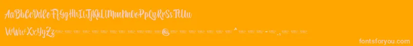 Reybro-Schriftart – Rosa Schriften auf orangefarbenem Hintergrund