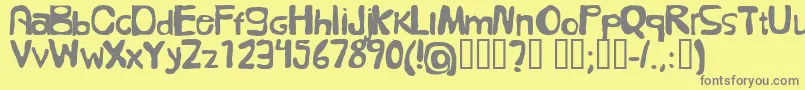 Fonte FolkГ¶l – fontes cinzas em um fundo amarelo