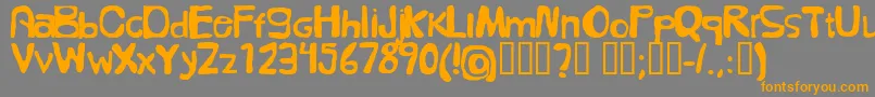 フォントFolkГ¶l – オレンジの文字は灰色の背景にあります。