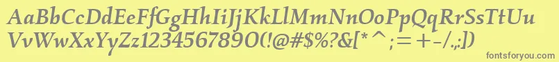 KallosmditcTtMediumitalic-fontti – harmaat kirjasimet keltaisella taustalla