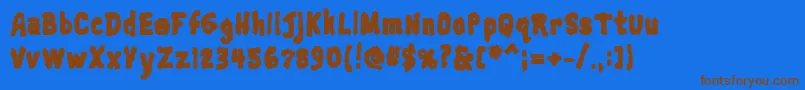 Fonte Trainwreckblack – fontes marrons em um fundo azul
