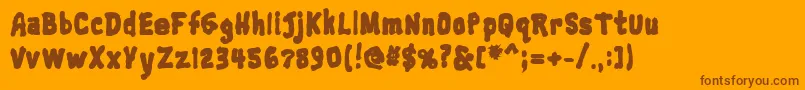Fonte Trainwreckblack – fontes marrons em um fundo laranja
