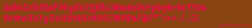 フォントTrainwreckblack – 赤い文字が茶色の背景にあります。