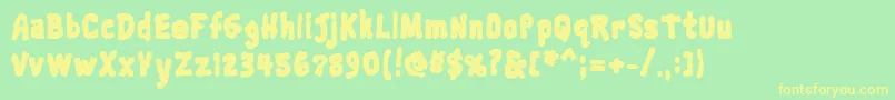 フォントTrainwreckblack – 黄色の文字が緑の背景にあります