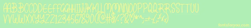 Kissy Font – Yellow Fonts on Green Background