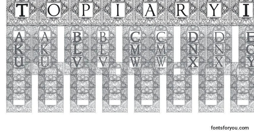 A fonte TopiaryInitials – alfabeto, números, caracteres especiais