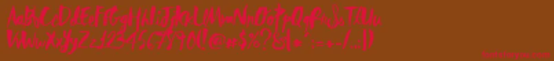 RebelHeartMadonna-Schriftart – Rote Schriften auf braunem Hintergrund