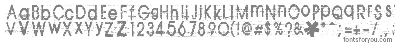 フォントTomva – 白い背景に灰色の文字