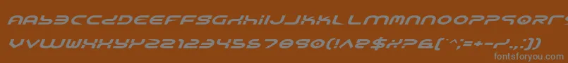 YukonTechExpandedItalic-fontti – harmaat kirjasimet ruskealla taustalla