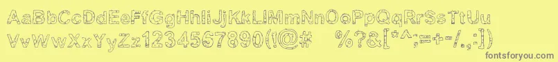 Yugly ffy-fontti – harmaat kirjasimet keltaisella taustalla
