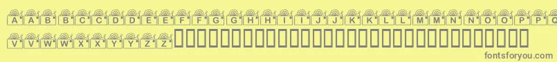 KrSnailMail-fontti – harmaat kirjasimet keltaisella taustalla