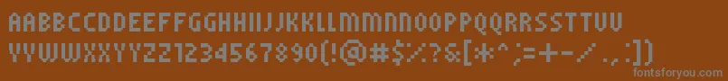 Czcionka PfTempestaFiveCompressed – szare czcionki na brązowym tle