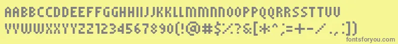 Czcionka PfTempestaFiveCompressed – szare czcionki na żółtym tle