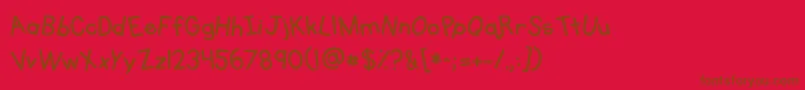 Fonte Kgprimarywhimsy – fontes marrons em um fundo vermelho