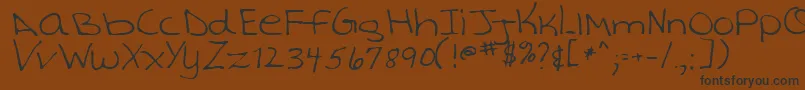 TashaRegular Font – Black Fonts on Brown Background