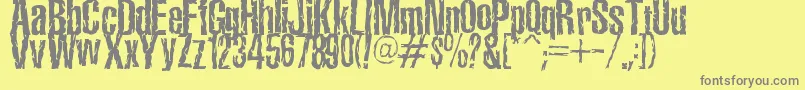TerroramaChiseled-fontti – harmaat kirjasimet keltaisella taustalla