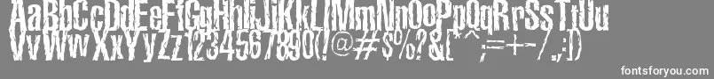 TerroramaChiseled-fontti – valkoiset fontit harmaalla taustalla