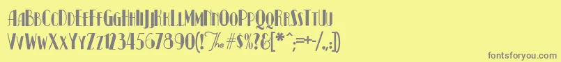 KismetNormal-fontti – harmaat kirjasimet keltaisella taustalla