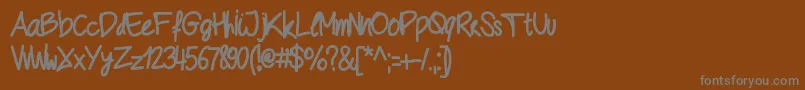 フォントGeschrift – 茶色の背景に灰色の文字