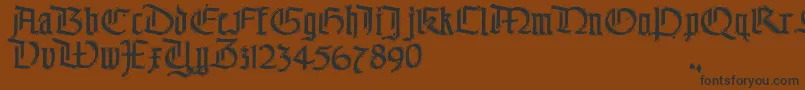 フォントThe – 黒い文字が茶色の背景にあります