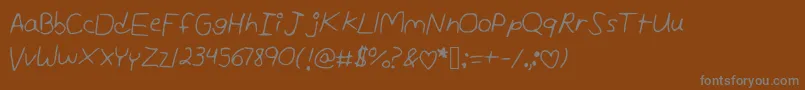 フォントAndreaunedited – 茶色の背景に灰色の文字