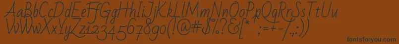 Badscript Font – Black Fonts on Brown Background