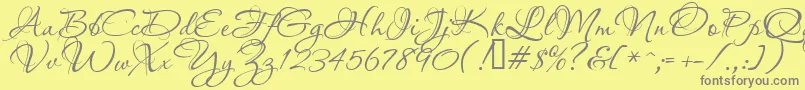 フォントAquarelle – 黄色の背景に灰色の文字