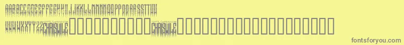 XspikedRegular-fontti – harmaat kirjasimet keltaisella taustalla