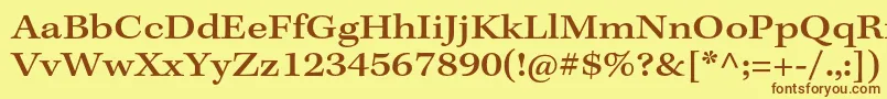 フォントKeplerstdMediumextcapt – 茶色の文字が黄色の背景にあります。