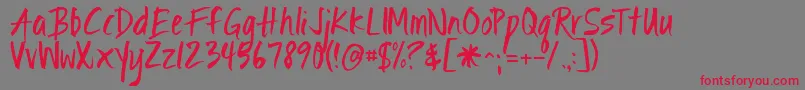 フォントIgnitethelight – 赤い文字の灰色の背景
