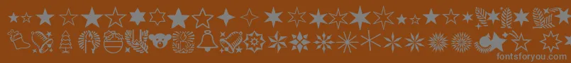 Więcej informacji o czcionce Xmasornamentone Czcionka Xmasornamentone – szare czcionki na brązowym tle