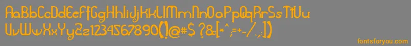 フォントAwelita – オレンジの文字は灰色の背景にあります。